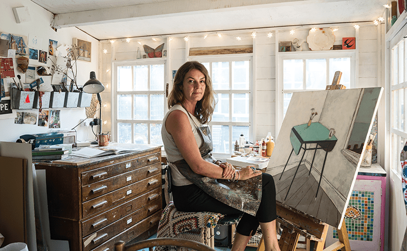 Back home in her studio, memories of the weekend resurface in Jo’s paintings. Here, her Aunt Peg’s table, a fixture of the beach hut, takes centre stage in a new composition