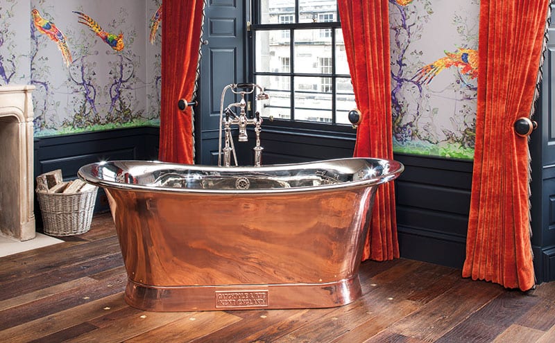 The Catchpole & Rye freestanding tub is a grand addition to the master suite, as is the fringing on the velvet GP&J Baker silk-lined curtains. 