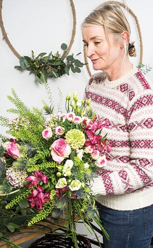 A bouquet ready to go, with roses, dahlias and snapdragons