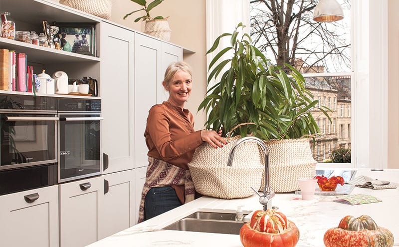 The family’s kitchen is open plan and double aspect, giving her sculptural plants plenty of natural light