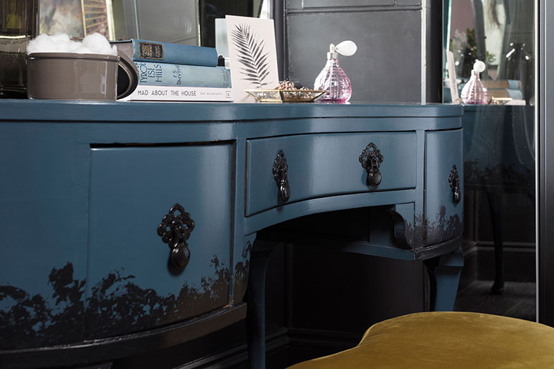 a close-up of the bespoke Done Up North dressing table in the master bedroom, which has black decoration added along its lower edge