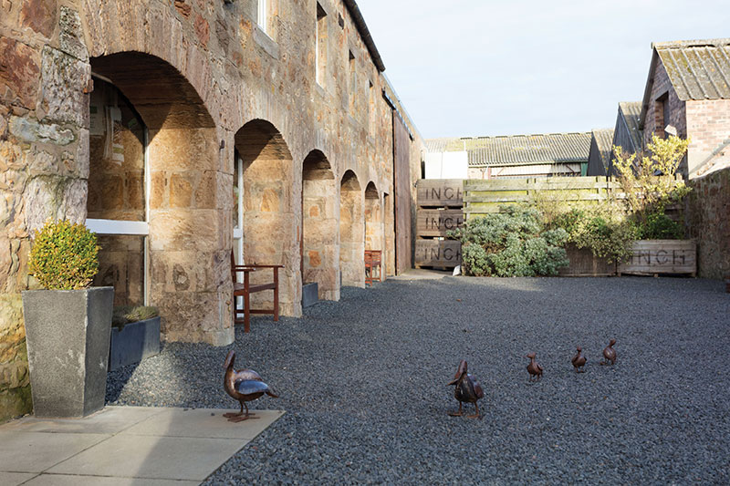 The arches of Ardross Farm Shop, which was originally an old cart shed. The ducks, made from old steel drums by Zimbolic, are a famous feature