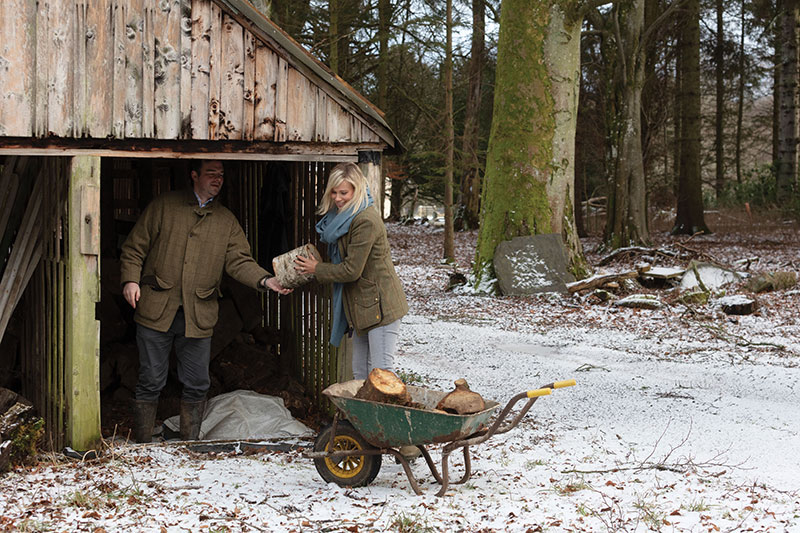 Chopping logs for the castle’s many fireplaces is one way to keep warm on snowy days