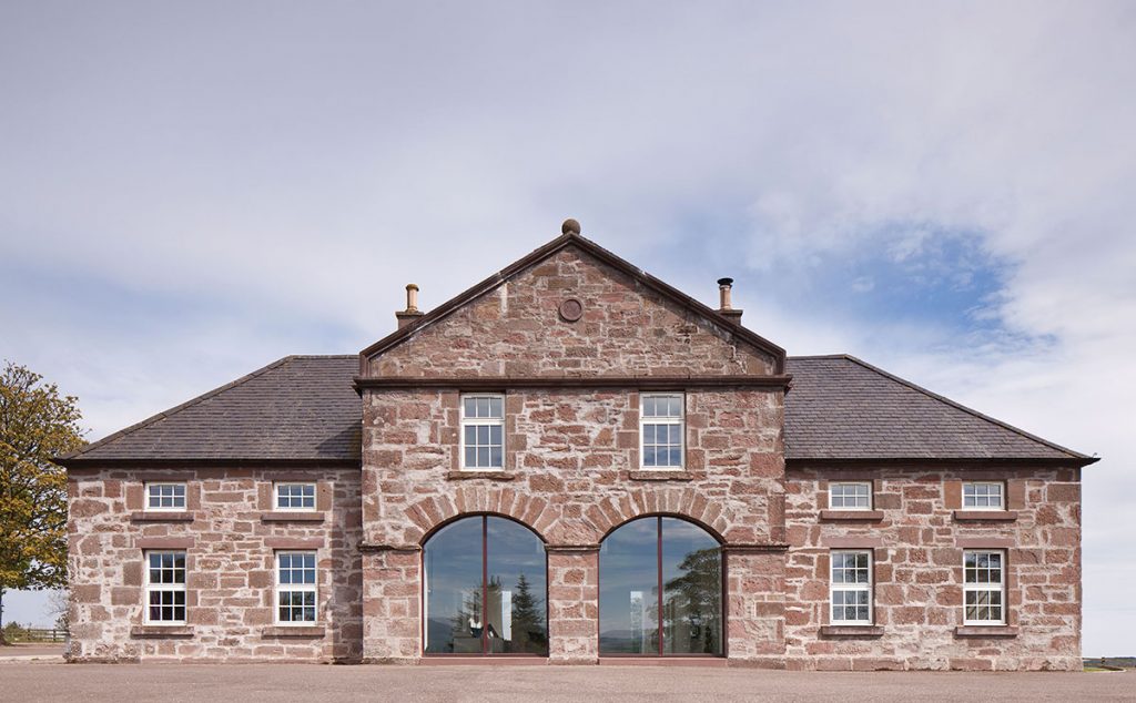 The elegantly symmetrical front of the house. The section in the middle was previously little more than a passageway; now, it has been opened up to the extension to the rear, creating much more living space