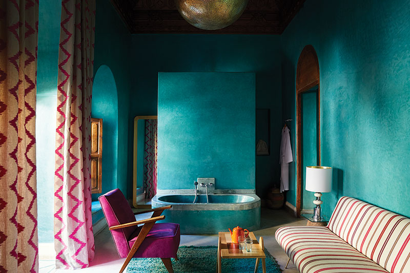 The intense teal pigment in the tadelakt-finished walls echoes the rich jewel tones that Marrakech is famous for. The bath has been hand-finished with silver accents and the vintage flea-market furniture has been covered in locally made kilim rugs and Berber blankets. Light fittings have been made in the nearby souks