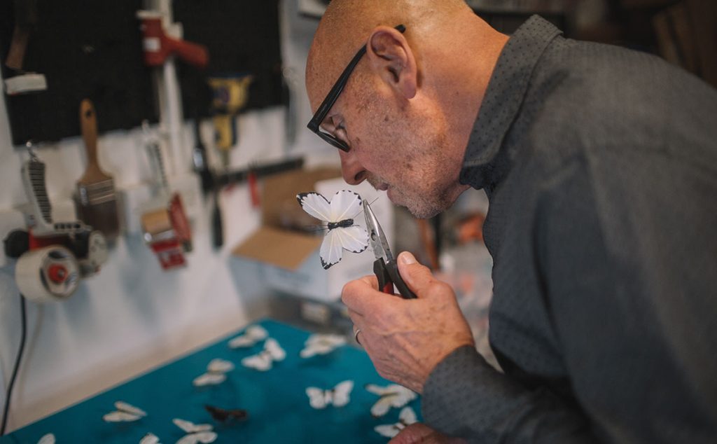 Michael Olsen making a butterfly artwork