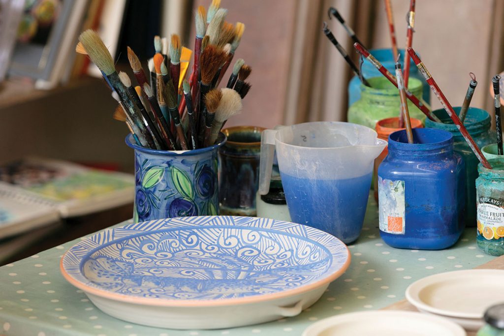 painted-pottery-next-to-paintbrushes