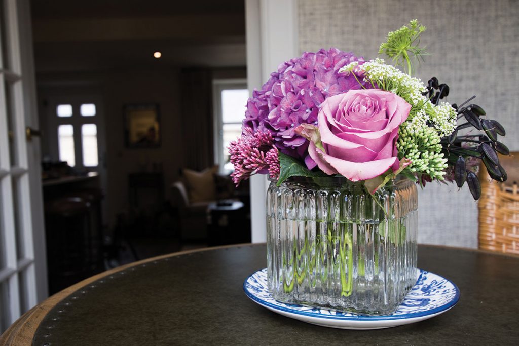 bunch-of-pink-and-green-flowers-on-table