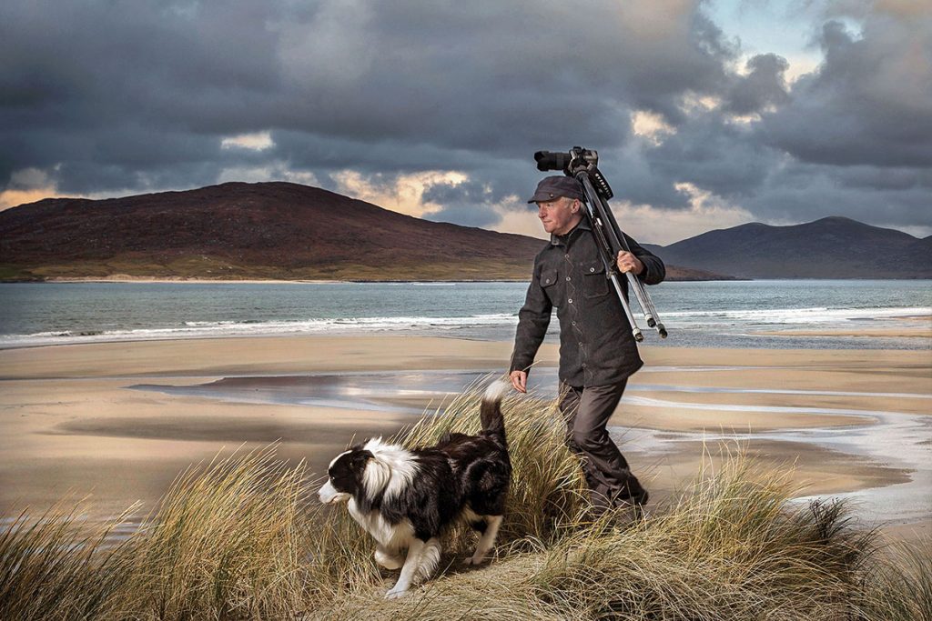 ian-lawson-walking-on-beach-in-the-hebrides-with-his-dog