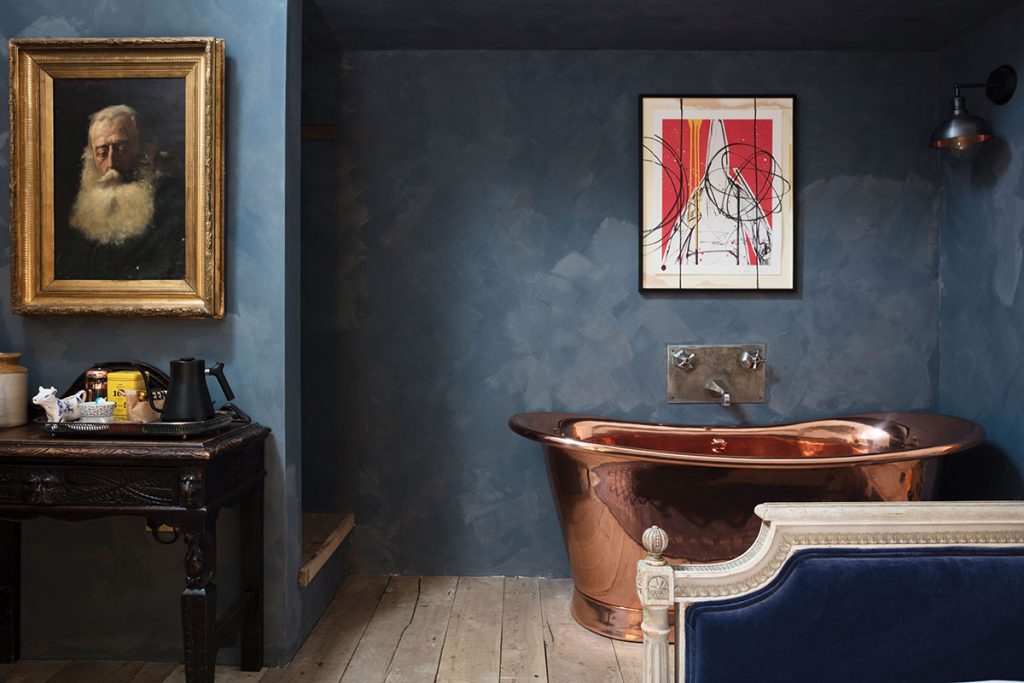 blue-bedroom-with-copper-freestanding-bath