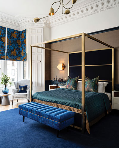 four-poster-gold-bed-in-blue-bedroom
