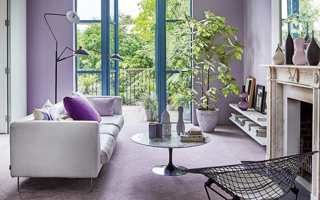 lilac carpeted living room with floor to ceiling French windows