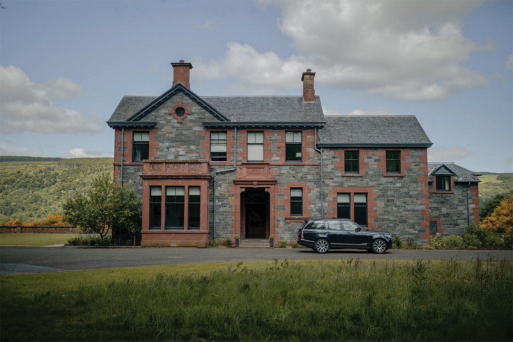 Dun Aluinn exterior shot with moody feel: large Victorian house