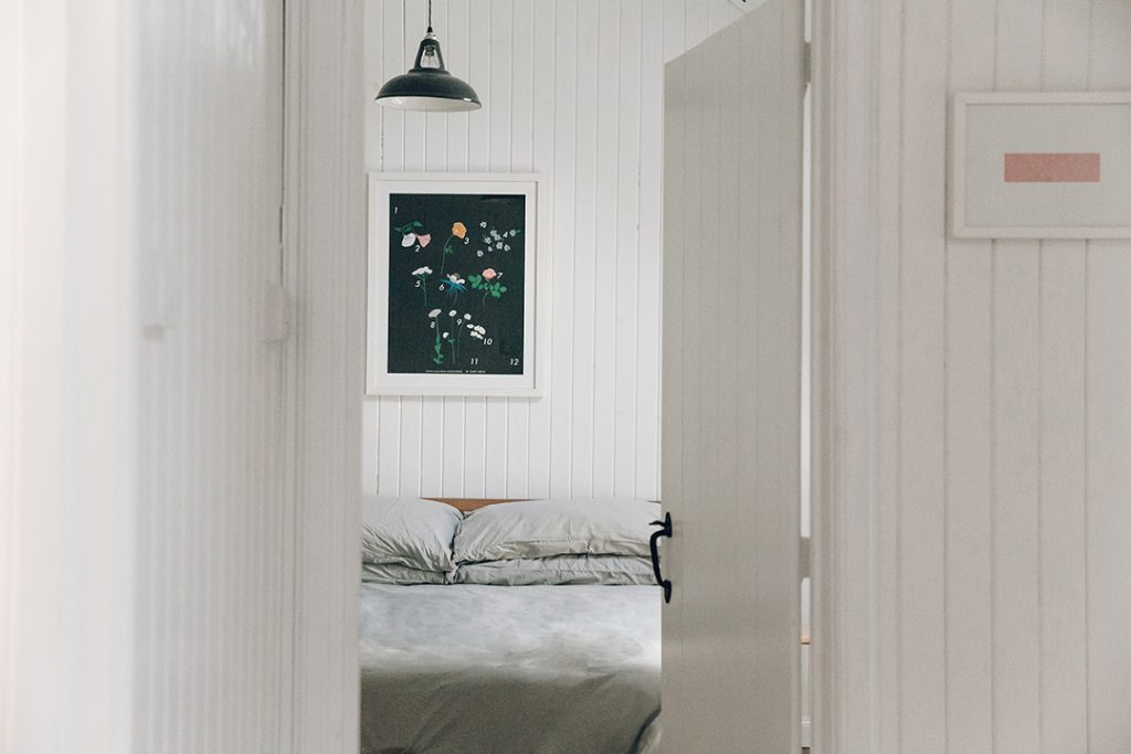 The door leading through to the whitewashed bedroom in The Crofter's House on Skye