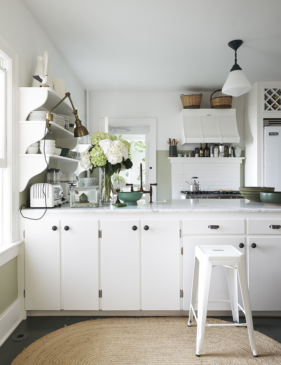 white kitchen, antique stool, pendant light 