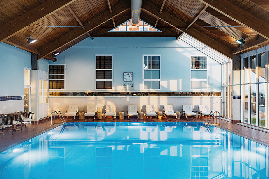 view of the swimming pool, roof apex, row of lounge chairs at Marine Troon