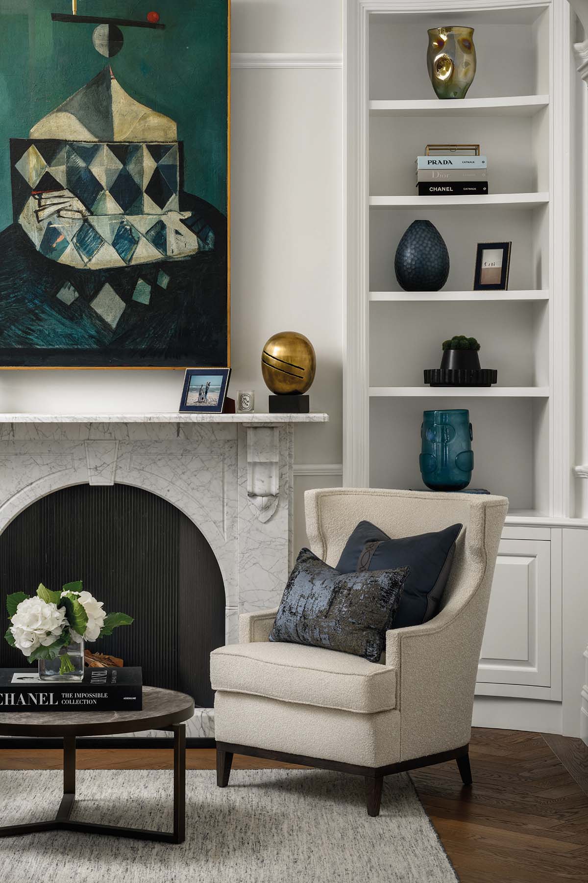 a quiet reading spot by the fireplace in the property's library 