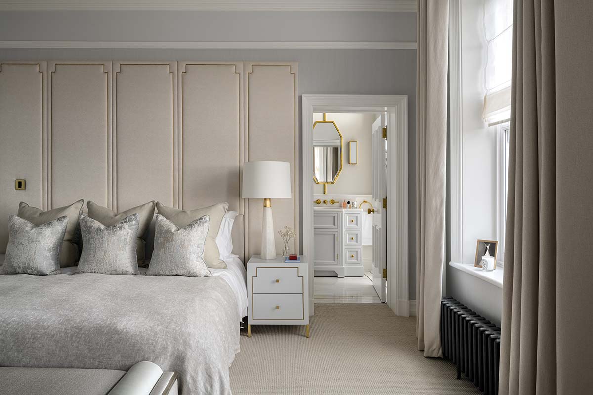 The bedroom is neutral with silvery accents and has an ensuite just seen 