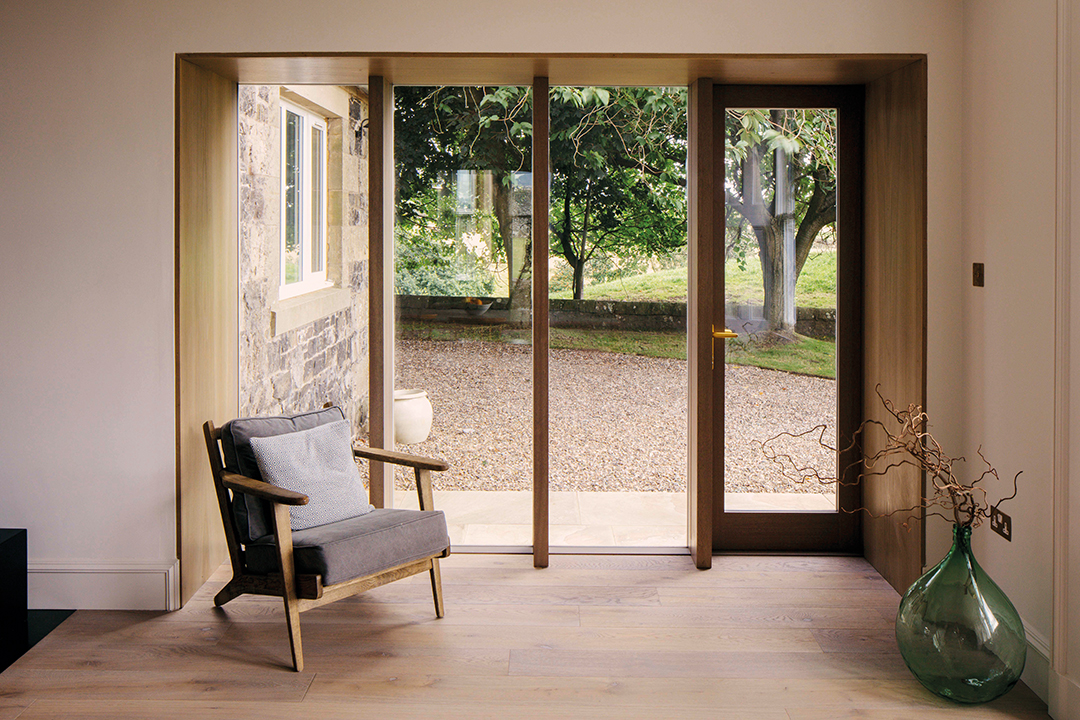 armchair positioned at glazed opening 