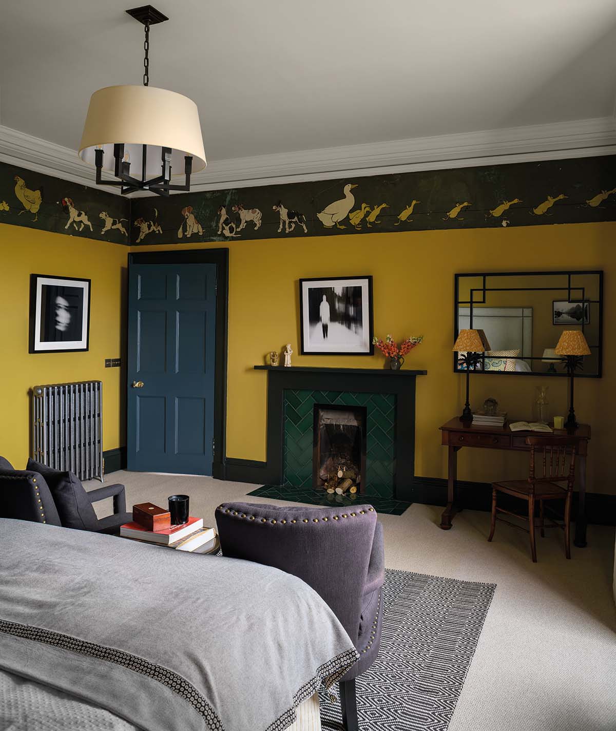 bedroom with yellow walls and a duck and duckling patterned border around the top of the room
