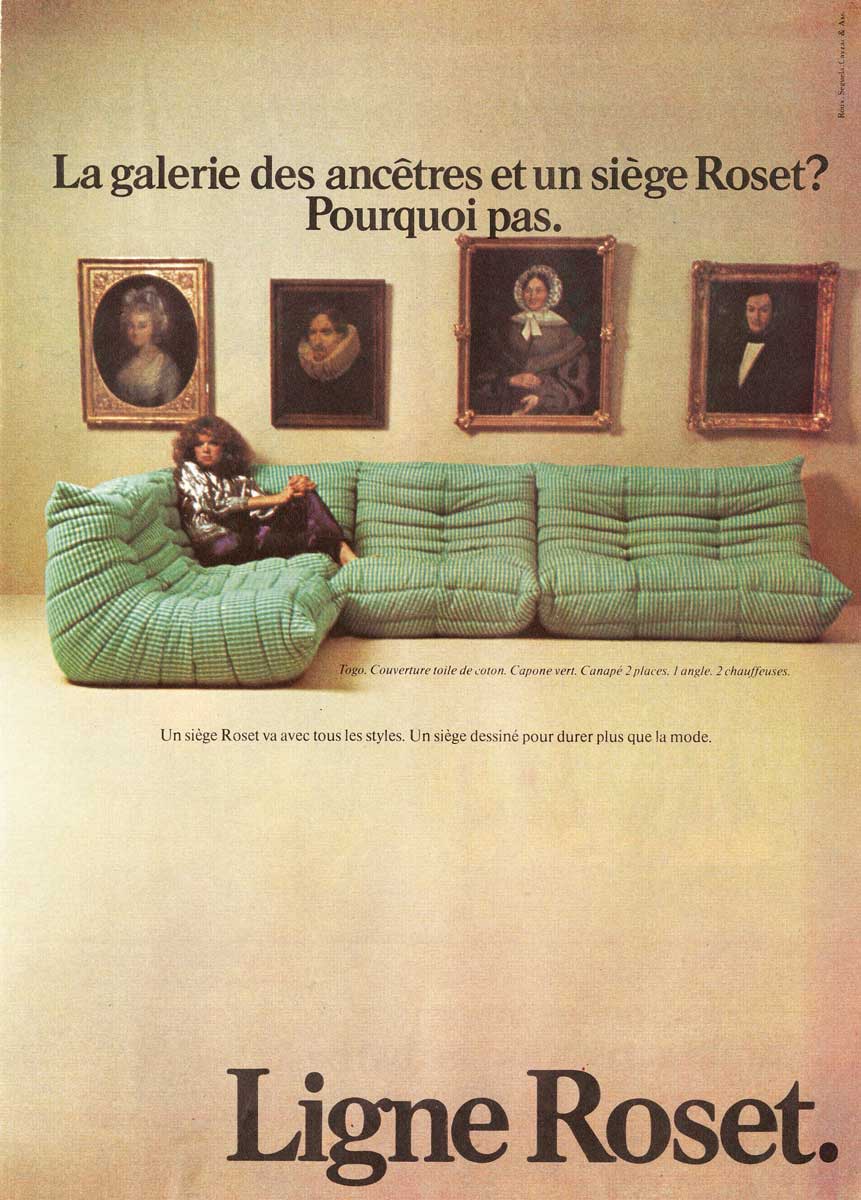 An archive advertisement for the Togo featuring a large mint green sofa and Ligne Roset logo