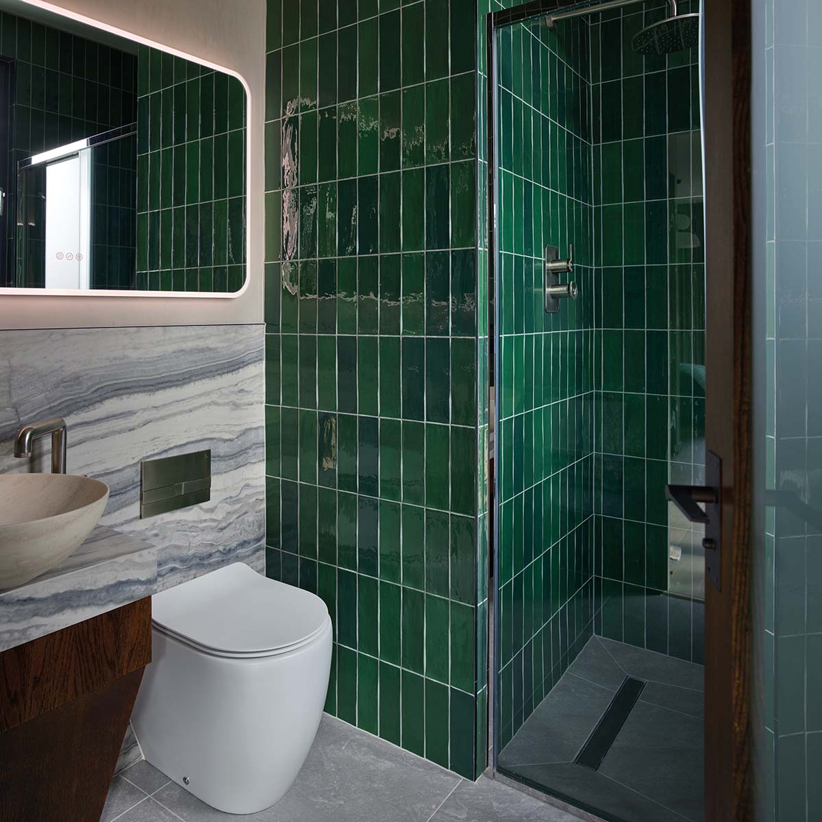 Green tiles in a beautiful bathroom. Miller's Cottage in Hamilton, South Lanarkshire