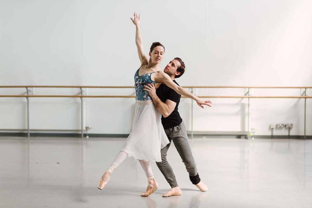 two ballerinas dancing together in the dance studios
