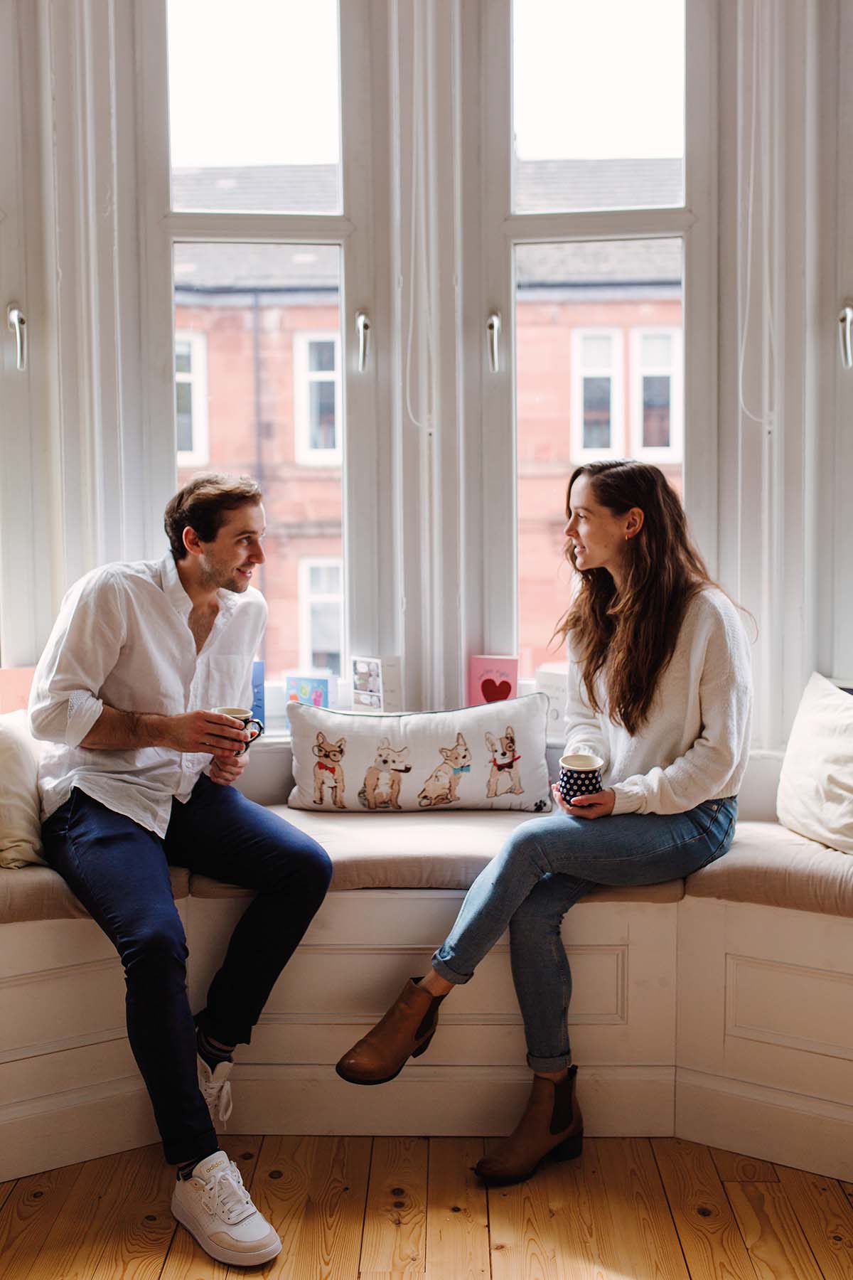 Scottish Ballet's principal dancers Bruno and Roseanna at home in Glasgow sitting by a window