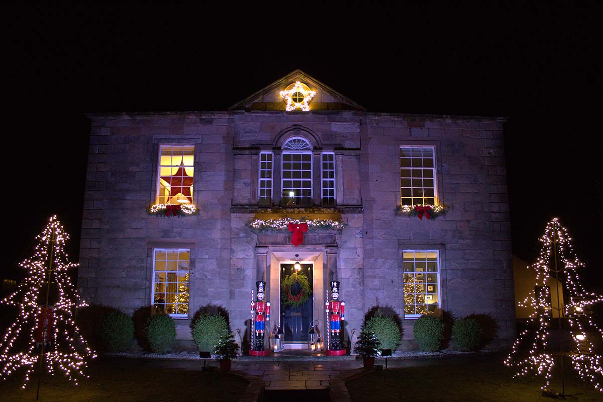 The exterior of a home decorated for Christmas