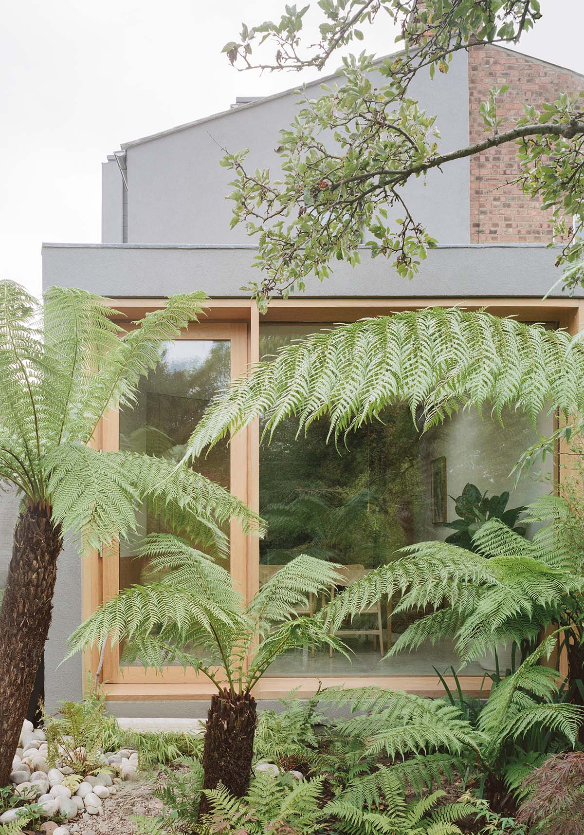 Passivhaus in London with floor to ceiling windows and a garden