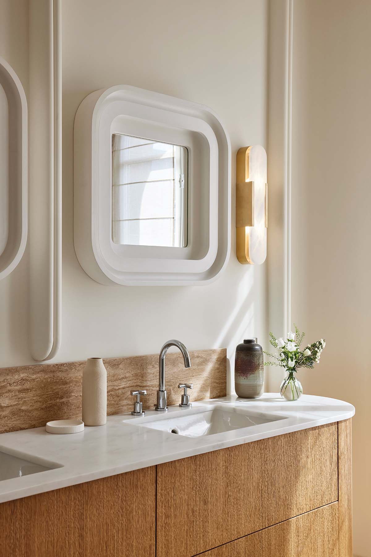 A bathroom in Paris, designed by Fabrice Jean featuring oak and plaster accents