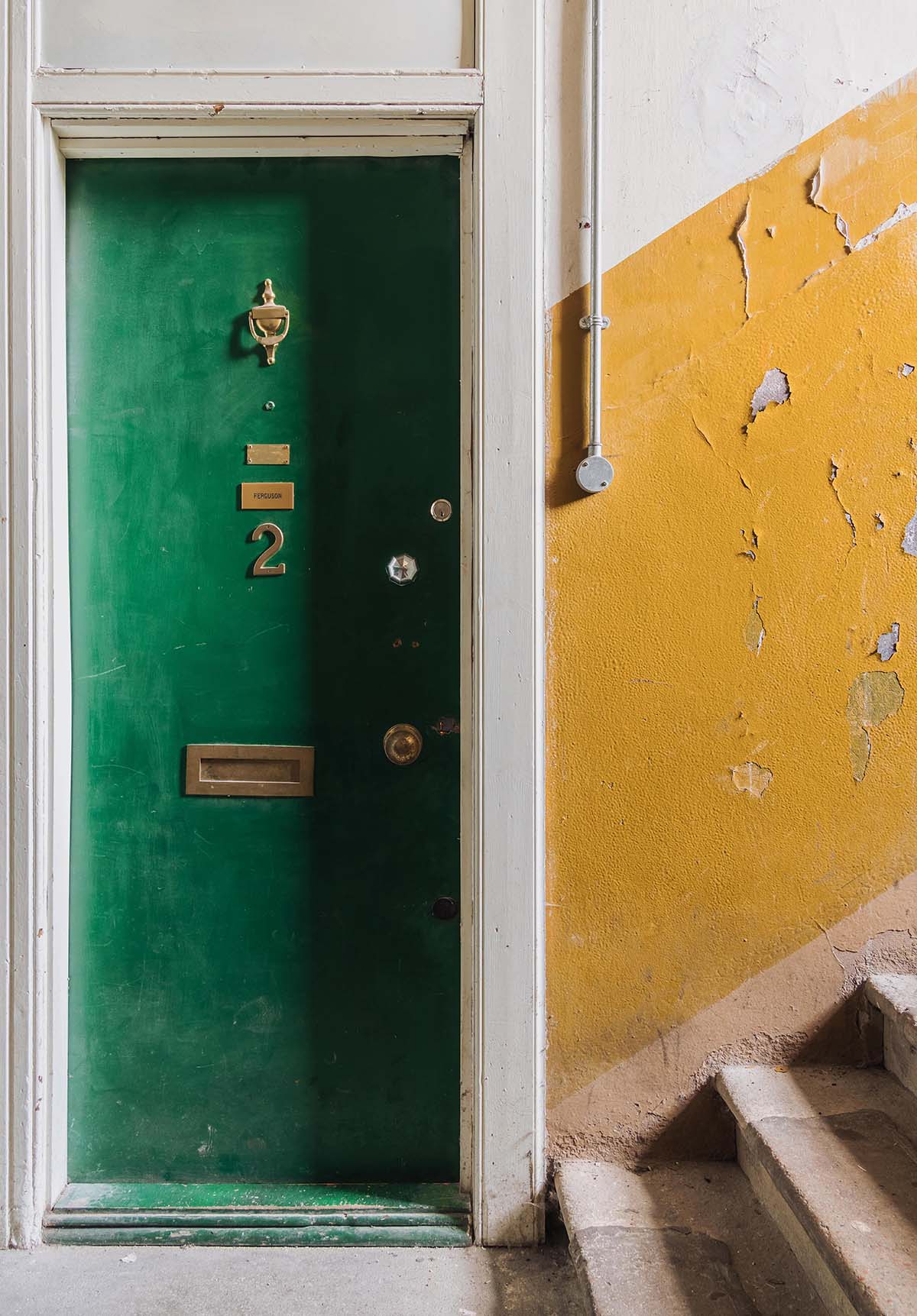 Green door in Glasgow tenement flat