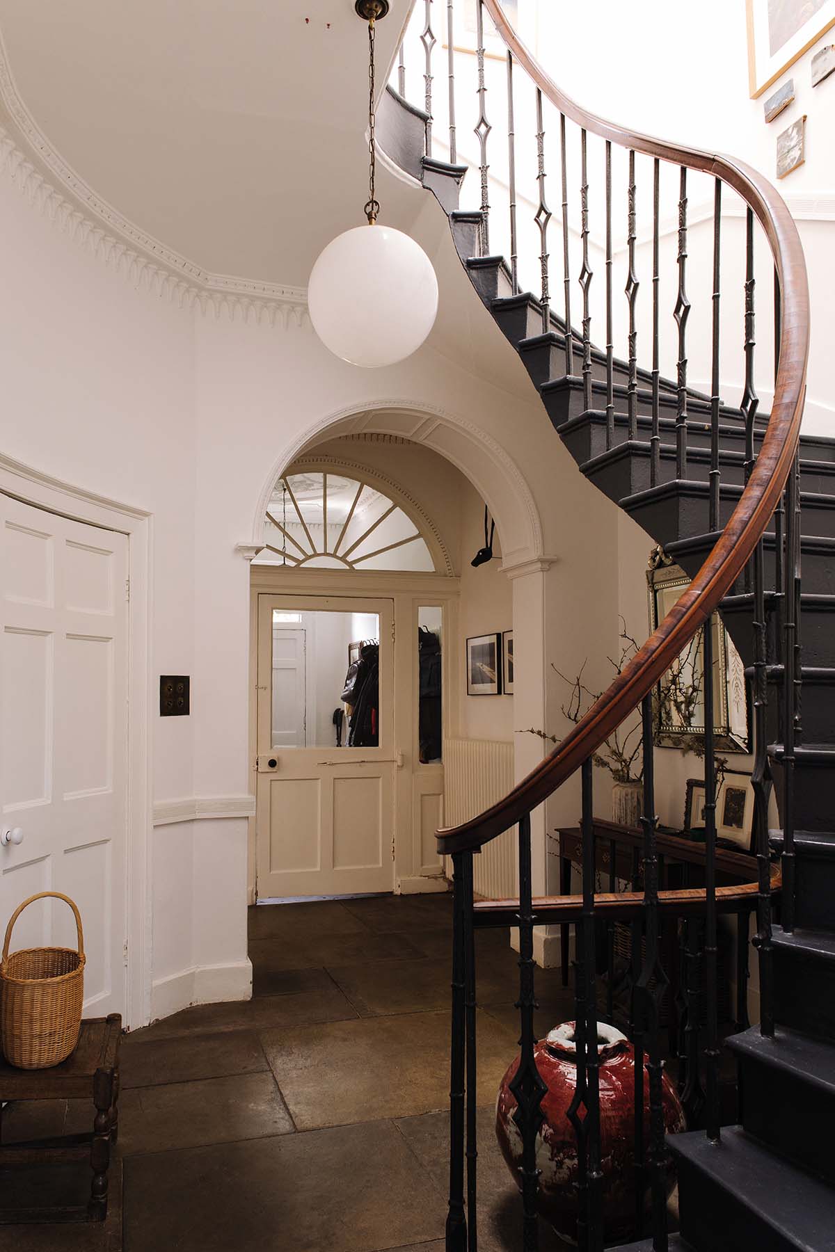 A curving staircase in the hallway of a Georgian home in Edinburgh