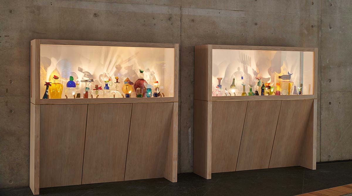 Glass objects displayed in light boxes at the Scottish Parliament