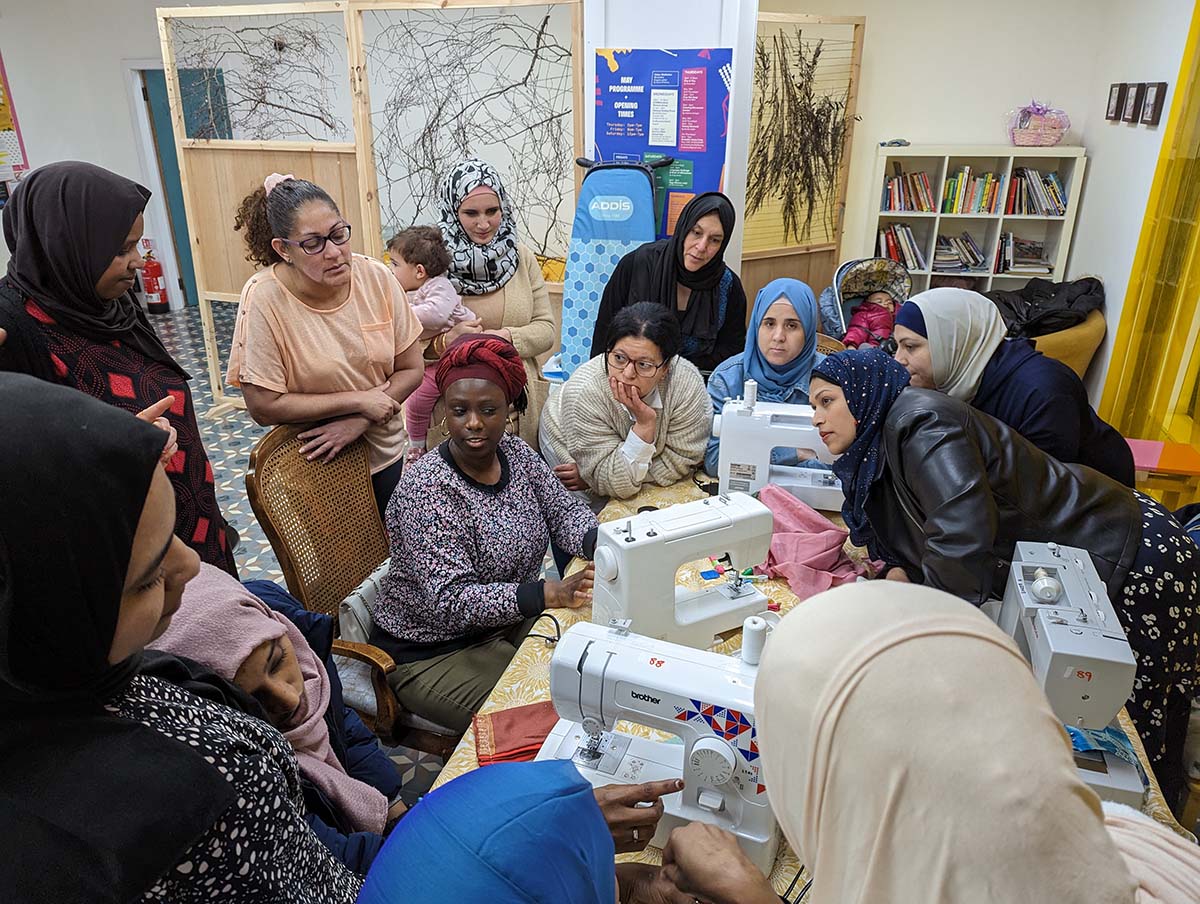 A group of women participating in a sewing workshop