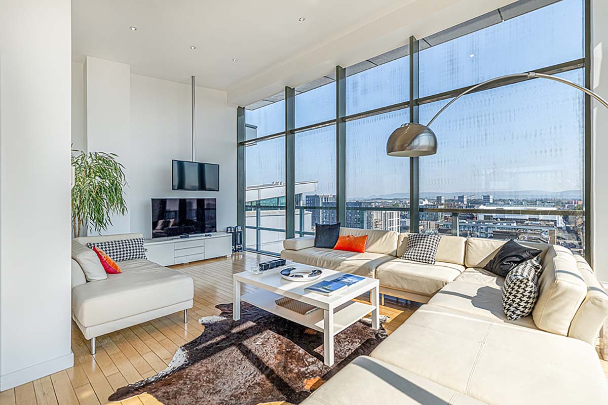 A penthouse apartment, with modern interiors and a view across Glasgow through floor to ceiling windows