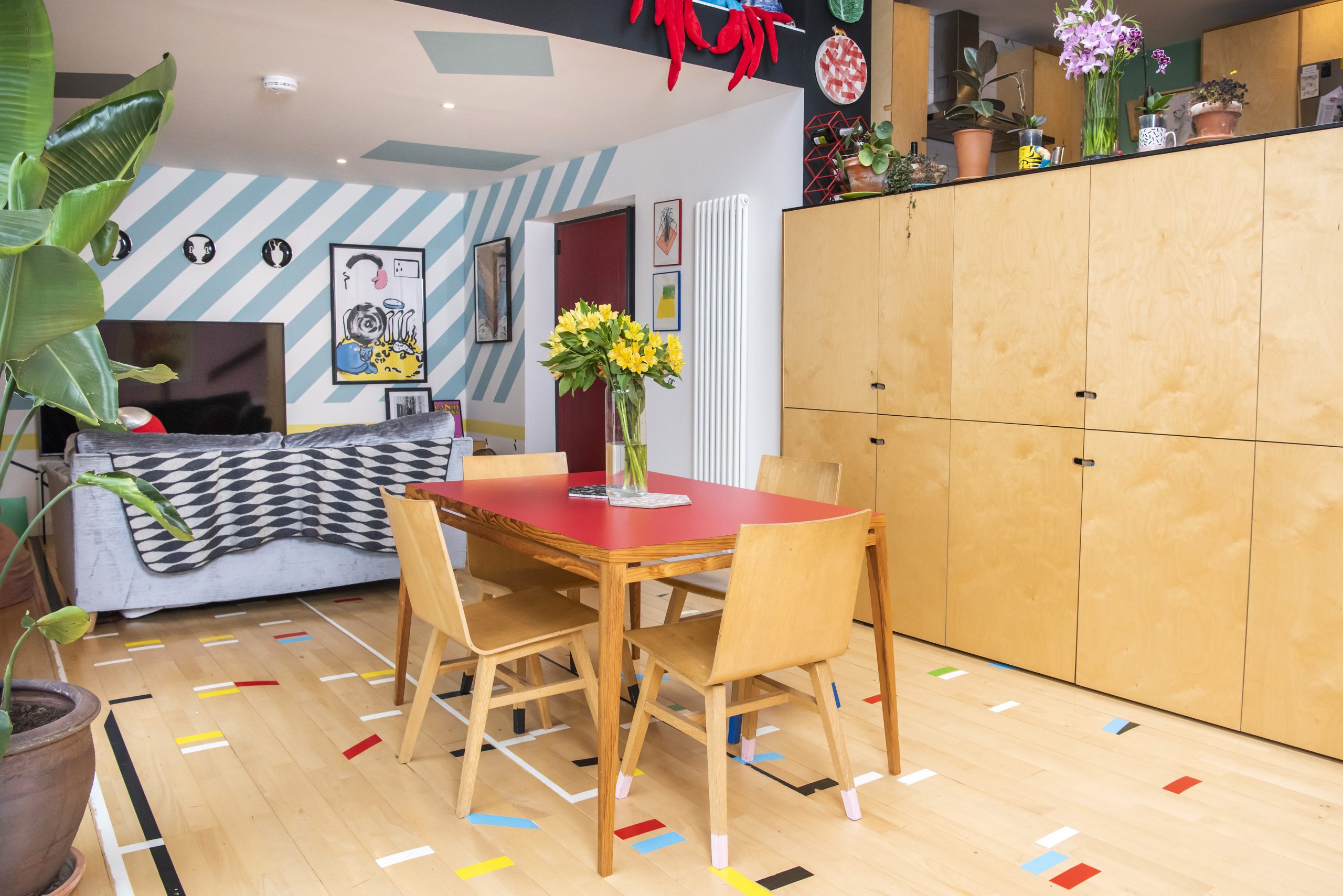 A 1960s extended bungalow on Scotland's Home of the Year 2024 - home to Anna, Harry and their daughters, Marley and Lexie. The twice-extended home boasts clever decorating techniques and reclaimed materials including school gym hall flooring complete with colourful markers