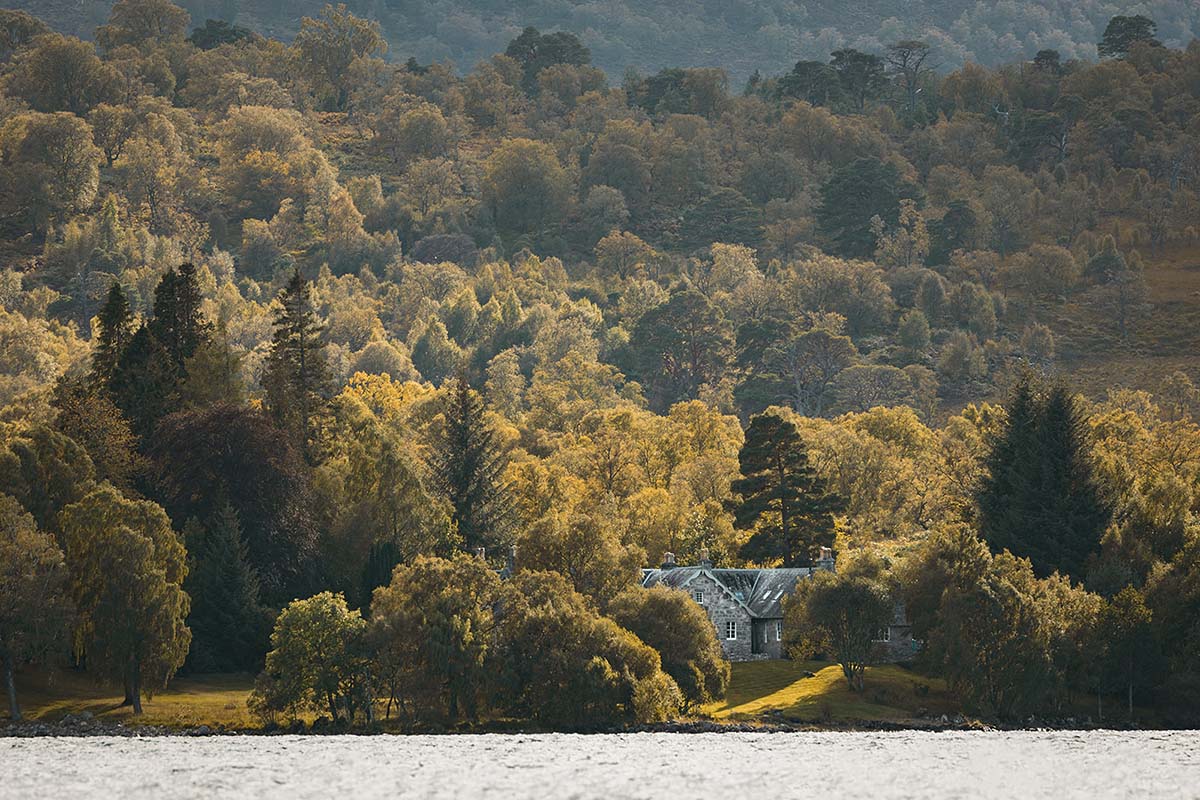 Croiscrag Lodge amongst the trees on the shores of Loch Rannoch, Scotland