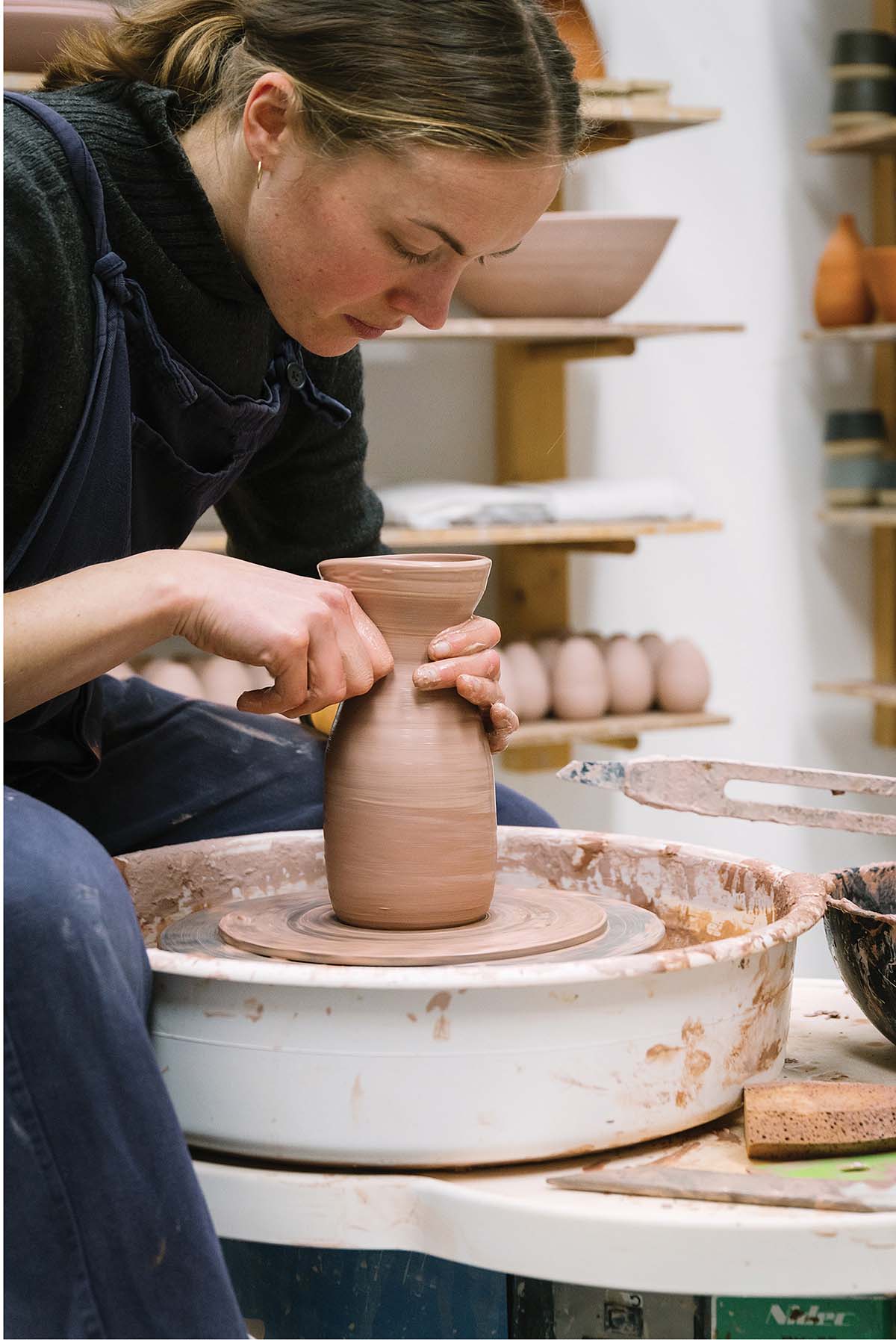 Cara Guthrie hard at work in her studio for Cara Guthrie Ceramics