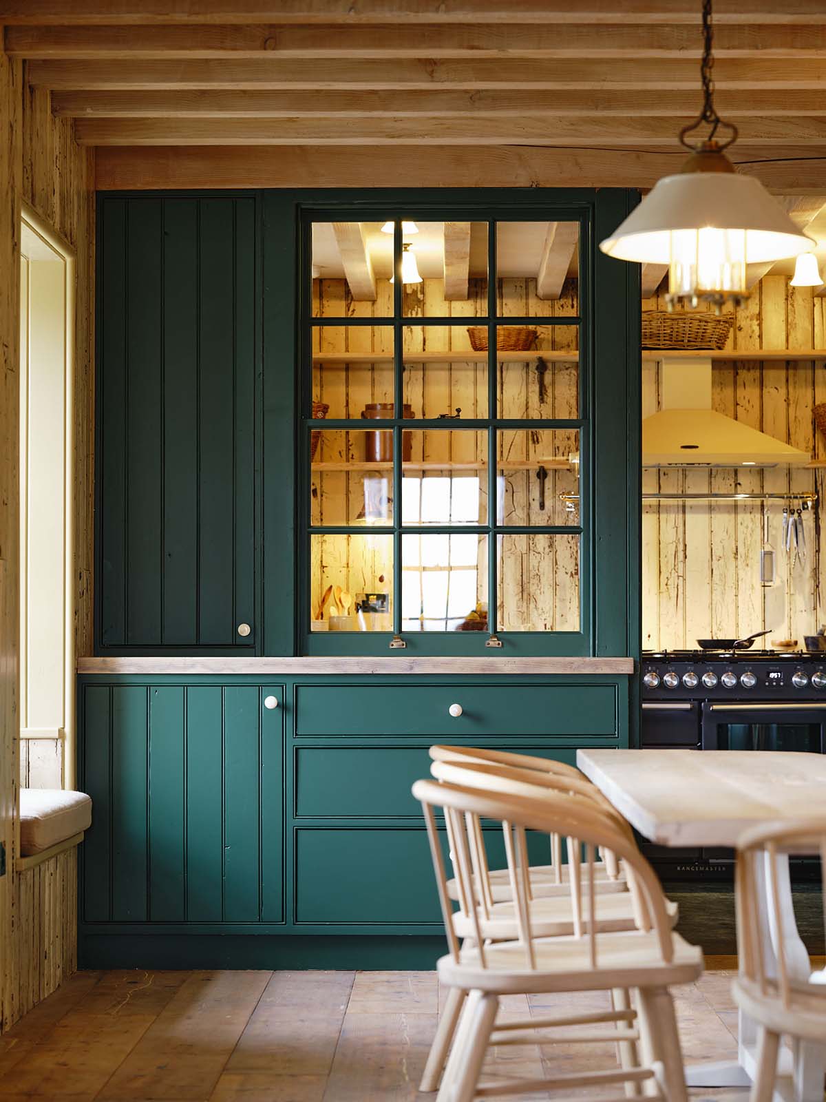 The captain's house on the Isle of Harris features a green panelled breakfast room for communal dining