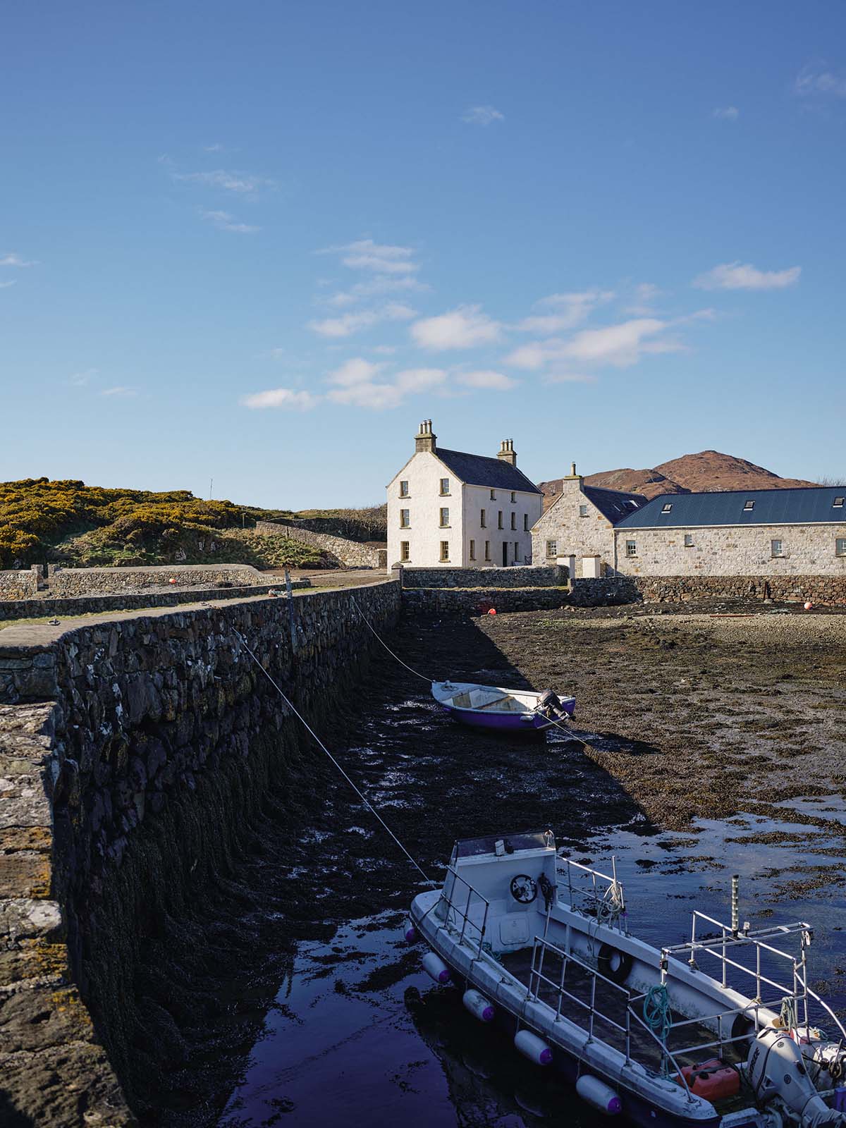 The exterior is pictured, nestled on the Isle of Harris