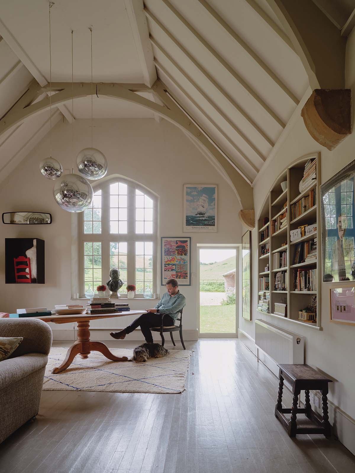 Bindloss Dawes architects on the project of this Victorian School House. Living area that opens a patio door to the garden and surrounding land, Victorian School House