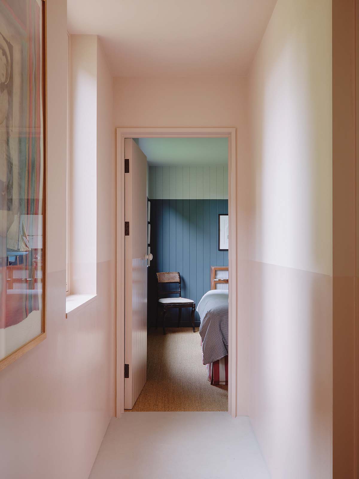 Bedroom of Joa Studholme's home with pink hallway