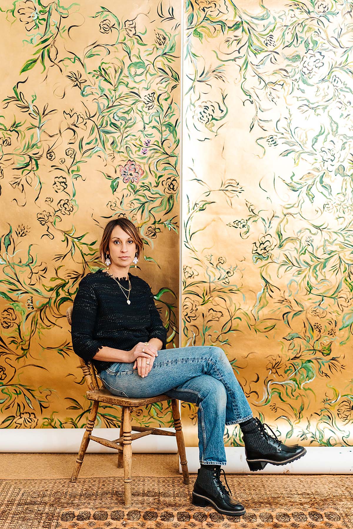 Claire Coles in front of newest wallpaper collection, Golden Hour