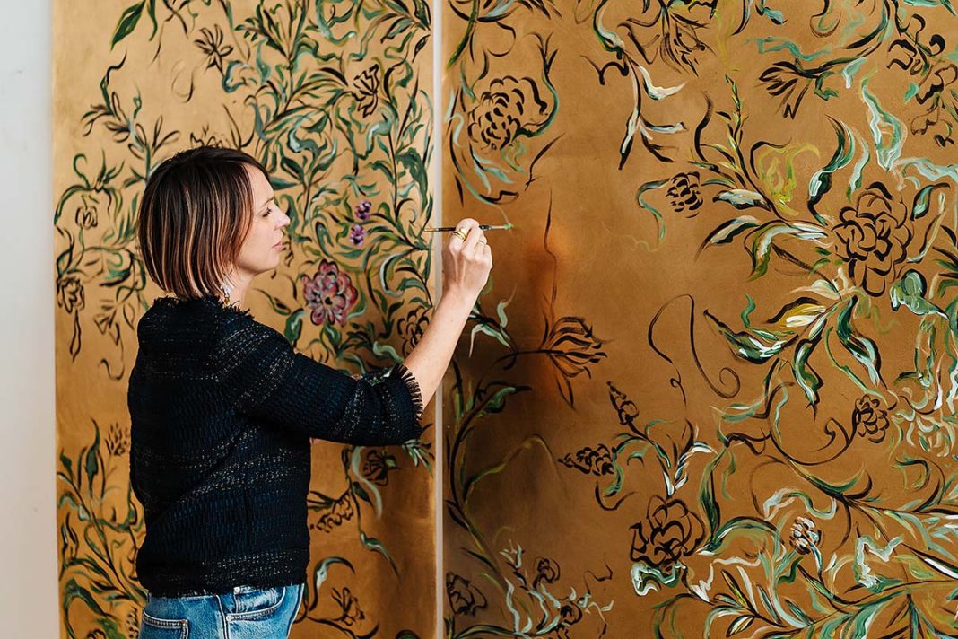 Claire Coles artist painting wallpaper directly onto walls in people's home