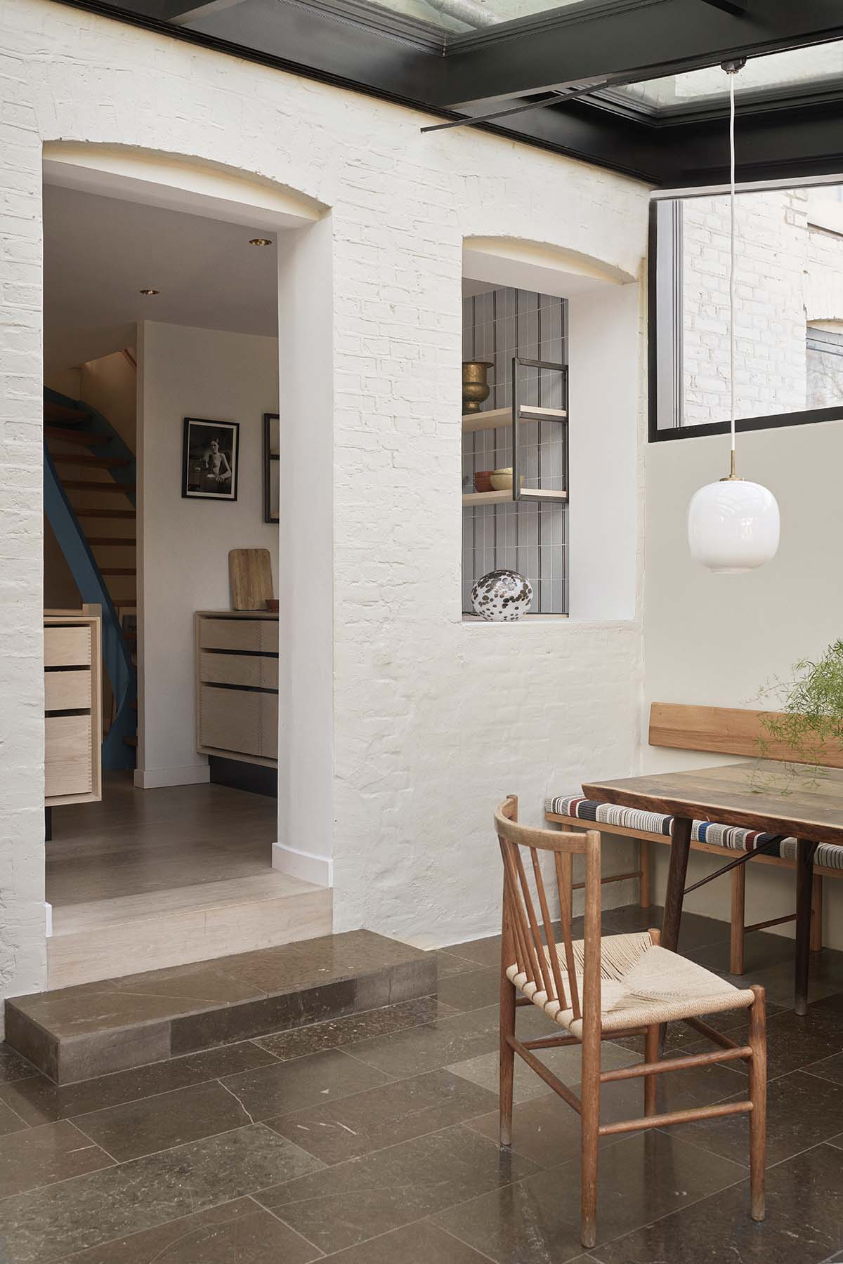 Kitchen dining area, with white cabinetry featured in a bespoke Garde Hvalsoe design