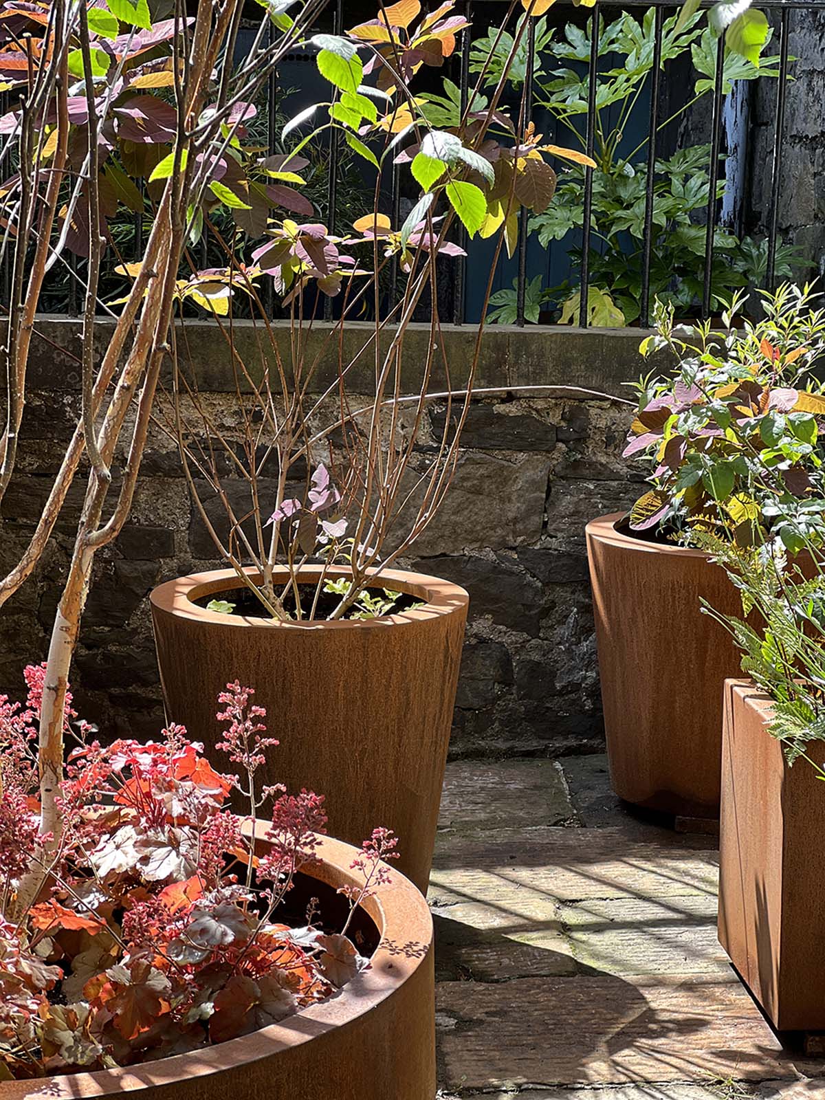 Steel planters in an Edinburgh gallery's back garden