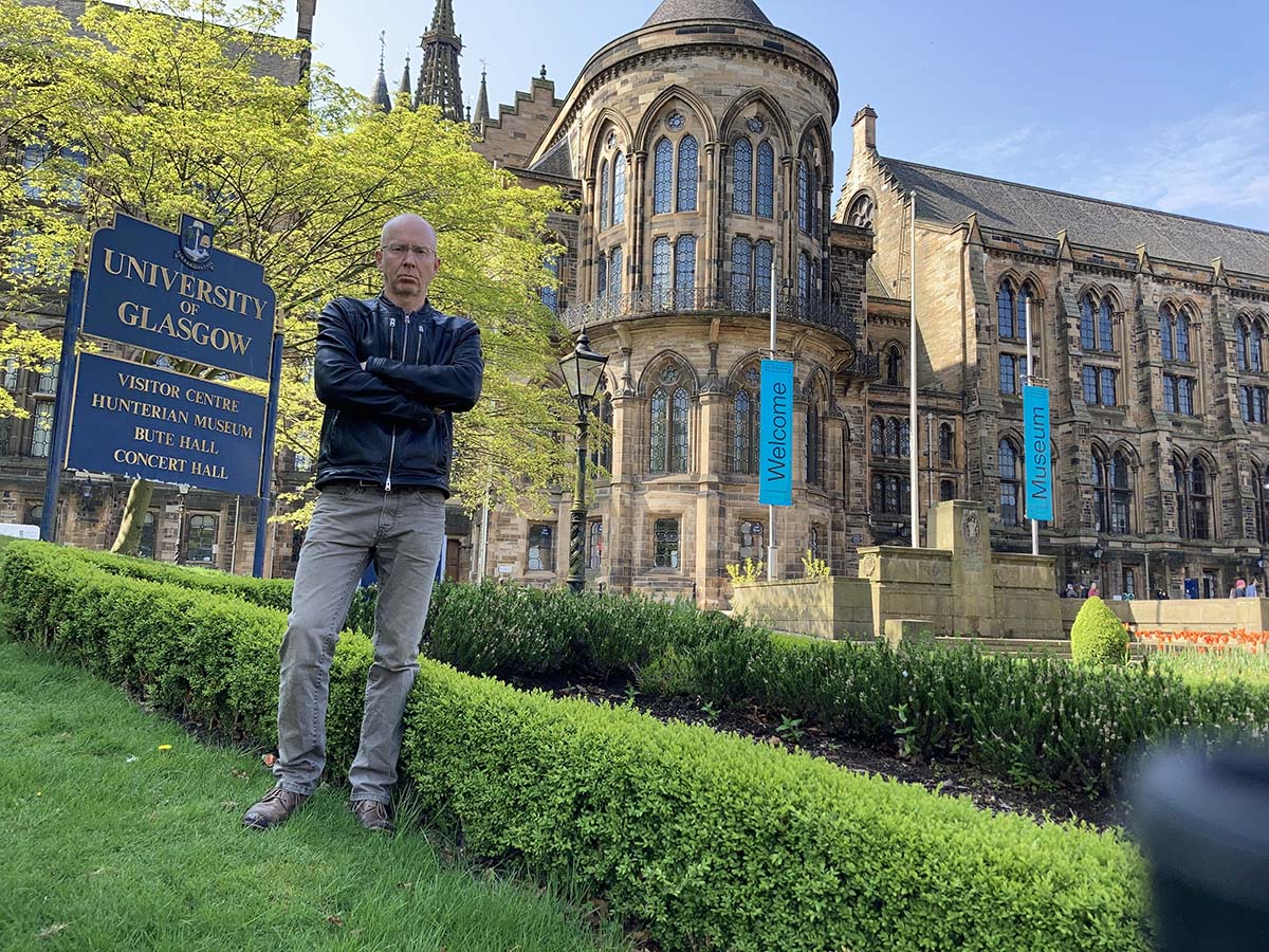 Gregor Harvie in fron of the University of Glasgow before his exhibition