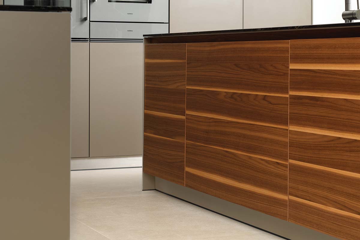 Walnut wooden panelling on cabinetry and storage throughout this Cameron Interiors design