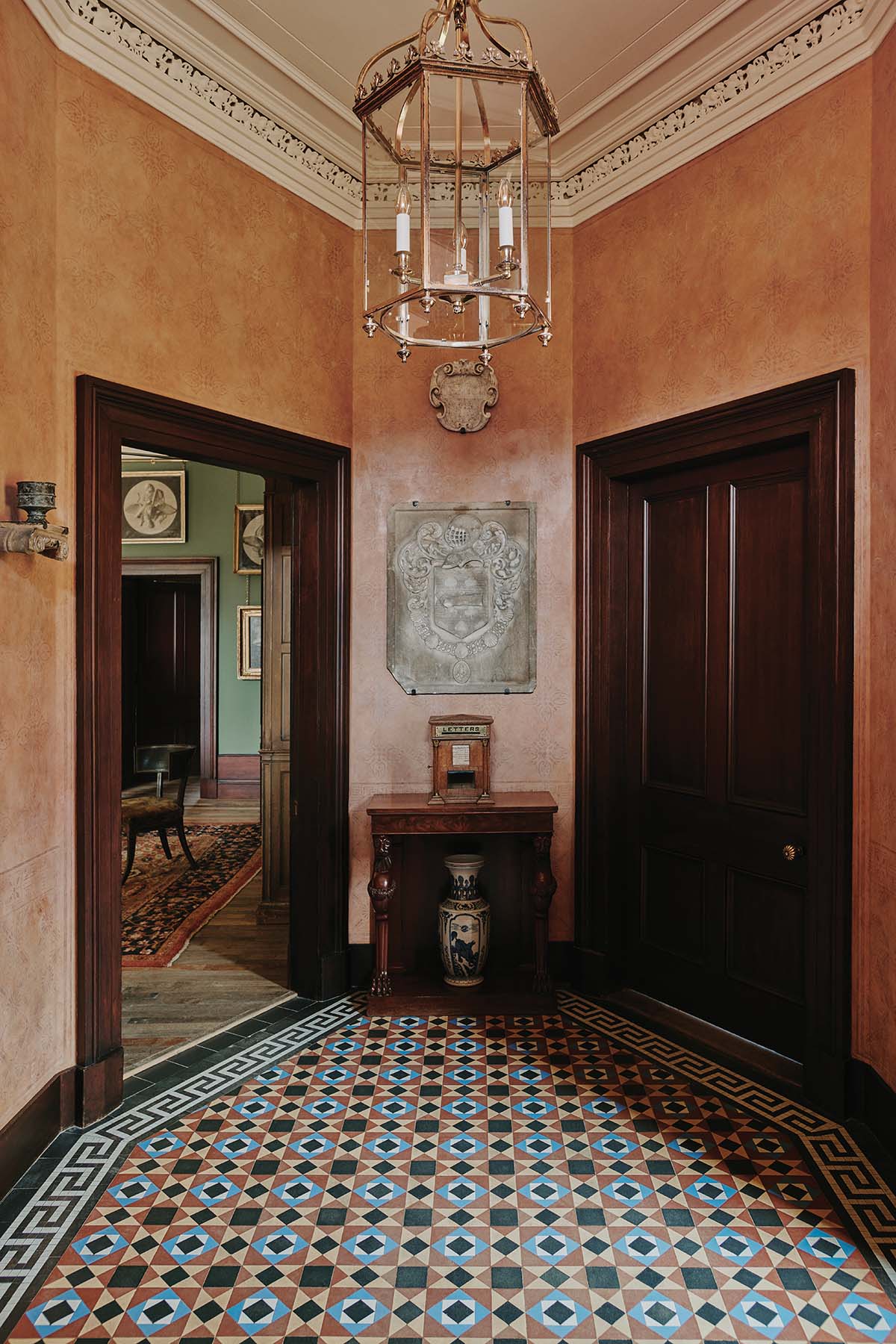 Peach walls and mosica floor of traditional Scottish castle near Loch Ness